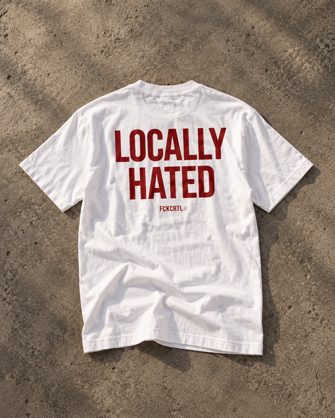 Locally Hated white T-shirt with red back print, editorial flat lay
